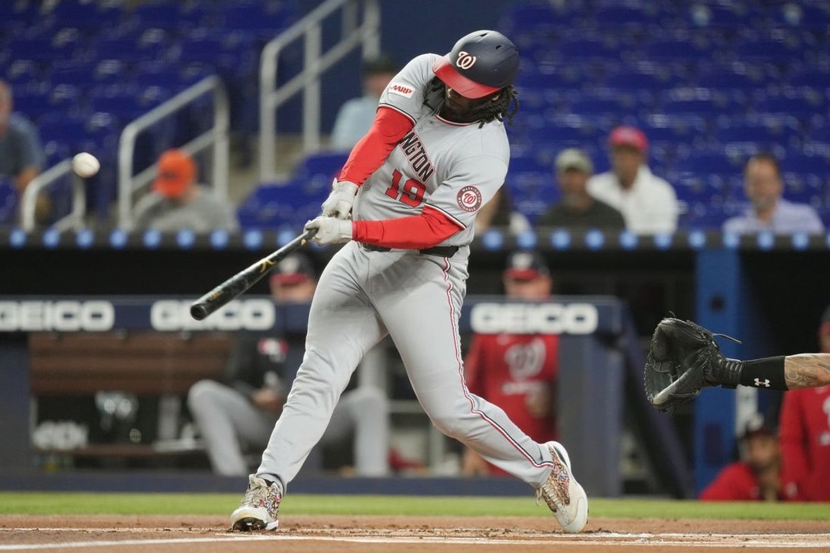 Sep 9, 2025; Miami, Florida, USA;  Washington Nationals first baseman Josh Bell (19) hits a three-run home run in the first inning against the Miami Marlins at loanDepot Park. Mandatory Credit: Jim Rassol-Imagn Images