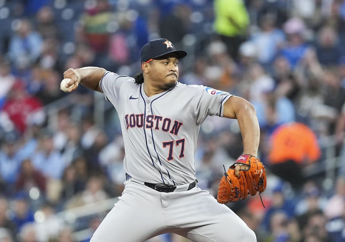Sep 9, 2025; Toronto, Ontario, CAN; Houston Astros starting pitcher Luis Garcia (77) throws a pitch against the Toronto Blue Jays during the first inning at Rogers Centre. Mandatory Credit: Nick Turchiaro-Imagn Images
