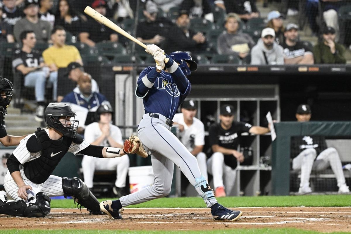 Sep 9, 2025; Chicago, Illinois, USA;  Tampa Bay Rays outfielder Chandler Simpson (14) hits an RBI single against the Chicago White Sox second inning at Rate Field. Mandatory Credit: Matt Marton-Imagn Images