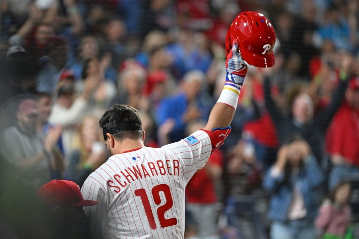 Sep 9, 2025; Philadelphia, Pennsylvania, USA; Philadelphia Phillies outfielder Kyle Schwarber (12) acknowledges the crowd after hitting his 50th home run of the season during the seventh inning against the New York Mets at Citizens Bank Park. Mandatory Credit: Eric Hartline-Imagn Images