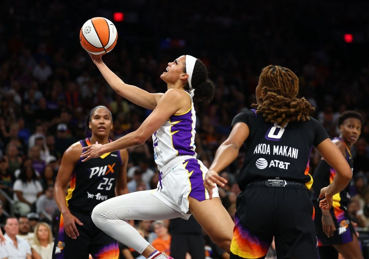 Sep 9, 2025; Phoenix, Arizona, USA; Los Angeles Sparks guard Rae Burrell (12) drives tot he basket against the Phoenix Mercury during the first half of a WNBA game at PHX Arena. Mandatory Credit: Mark J. Rebilas-Imagn Images