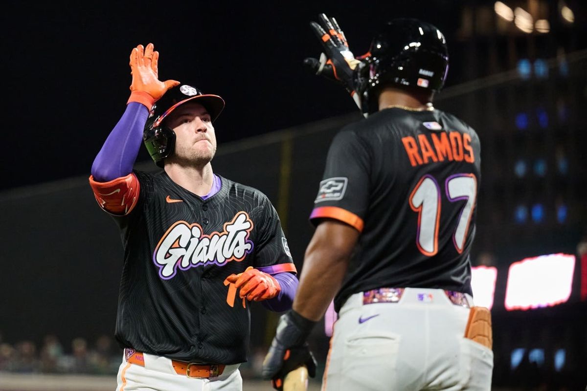 Sep 9, 2025; San Francisco, California, USA; San Francisco Giants catcher Patrick Bailey (14) celebrates with outfielder Heliot Ramos (17) after hitting a one run home run against Arizona Diamondbacks starting pitcher Zac Gallen (23) (not pictured) during the fifth inning at Oracle Park. Mandatory Credit: Robert Edwards-Imagn Images