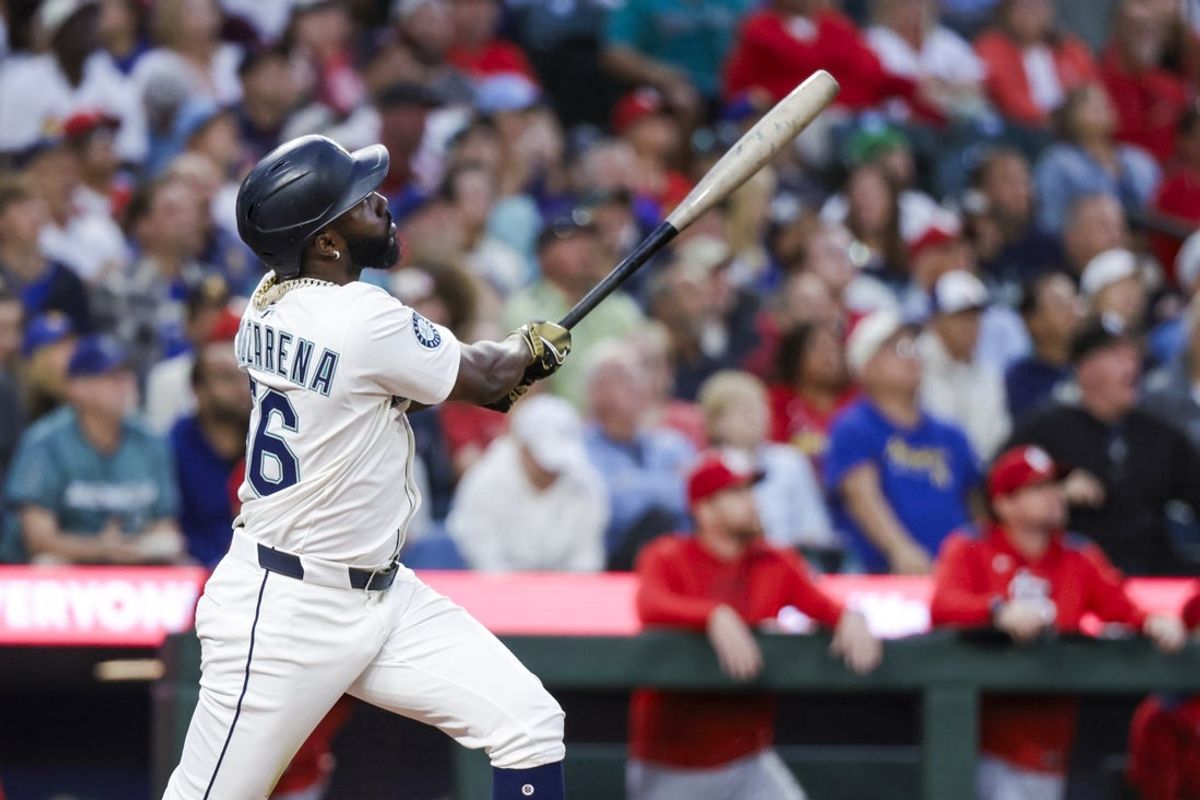 Sep 9, 2025; Seattle, Washington, USA; Seattle Mariners left fielder Randy Arozarena (56) hits a three-run home run against the St. Louis Cardinals during the third inning at T-Mobile Park. Mandatory Credit: Joe Nicholson-Imagn Images