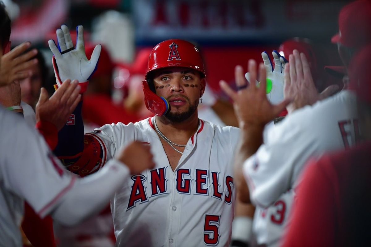 Sep 9, 2025; Anaheim, California, USA; Los Angeles Angels third baseman Yoán Moncada (5) is greeted by third base coach Bo Porter (88) after hitting a three run home run against the Minnesota Twins during the seventh inning at Angel Stadium. Mandatory Credit: Gary A. Vasquez-Imagn Images