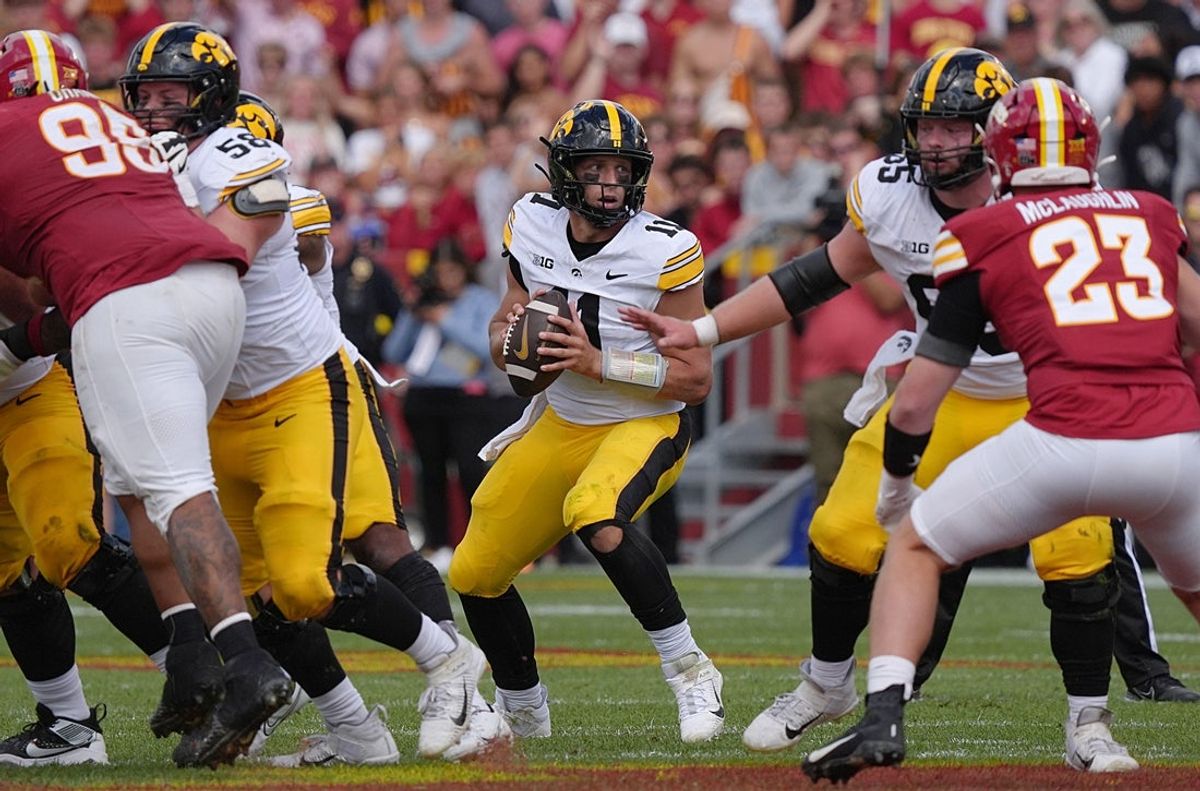 Iowa Hawkeyes quarterback Mark Gronowski (11) looks for a pass against Iowa State during the fourth quarter in the Cy-Hawk football at Jack Trice Stadium on Sept. 6, 2025, in Ames, Iowa