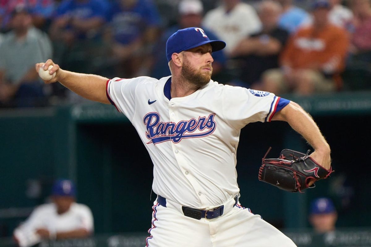Sep 10, 2025; Arlington, Texas, USA; Texas Rangers pitcher Merrill Kelly throws a pitch against the Milwaukee Brewers at Globe Life Field. Mandatory Credit: Jim Cowsert-Imagn Images