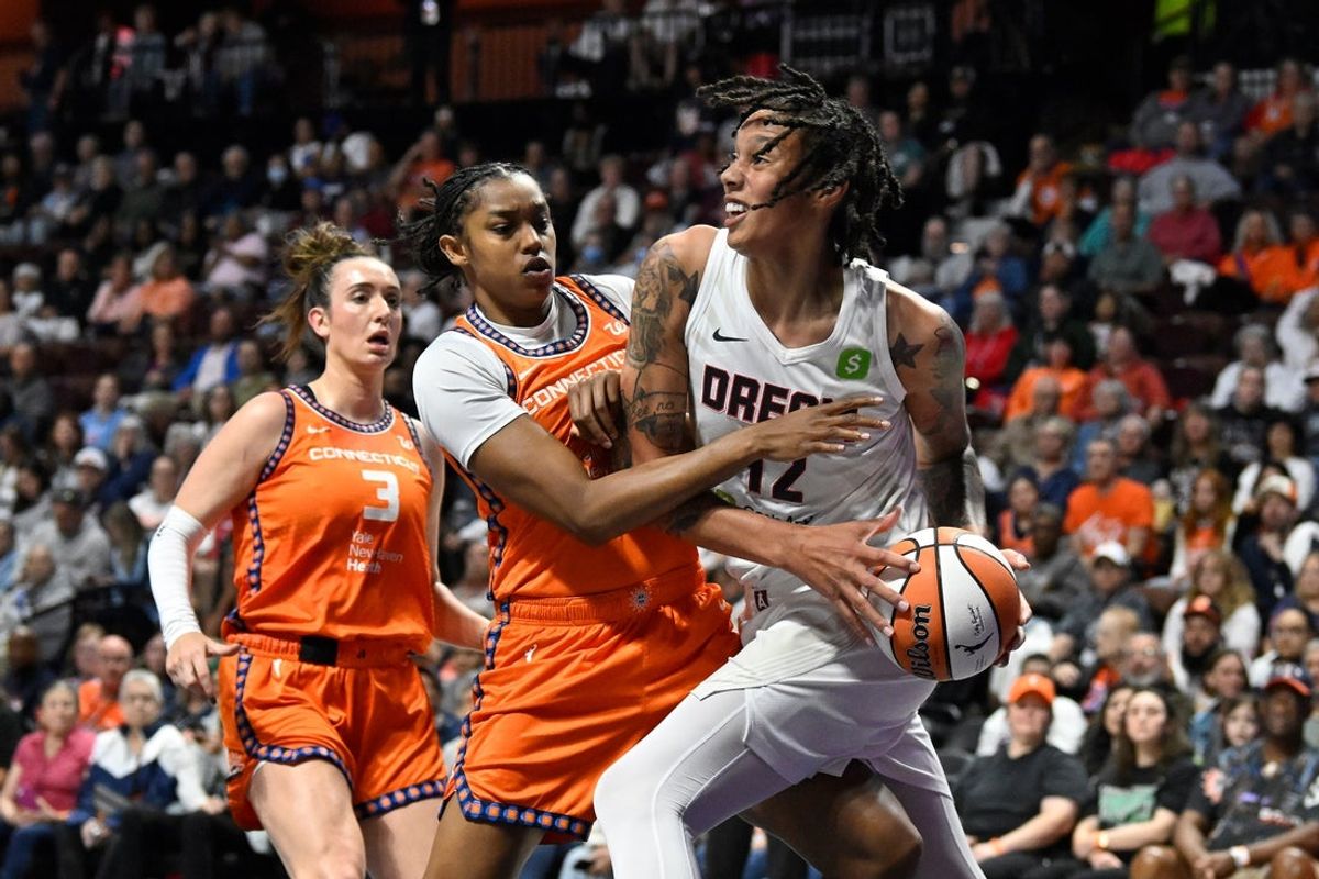 Sep 10, 2025; Uncasville, Connecticut, USA; Atlanta Dream center Brittney Griner (42) battles Connecticut Sun center Rayah Marshall (13) to take a shot during the first half at Mohegan Sun Arena. Mandatory Credit: Eric Canha-Imagn Images