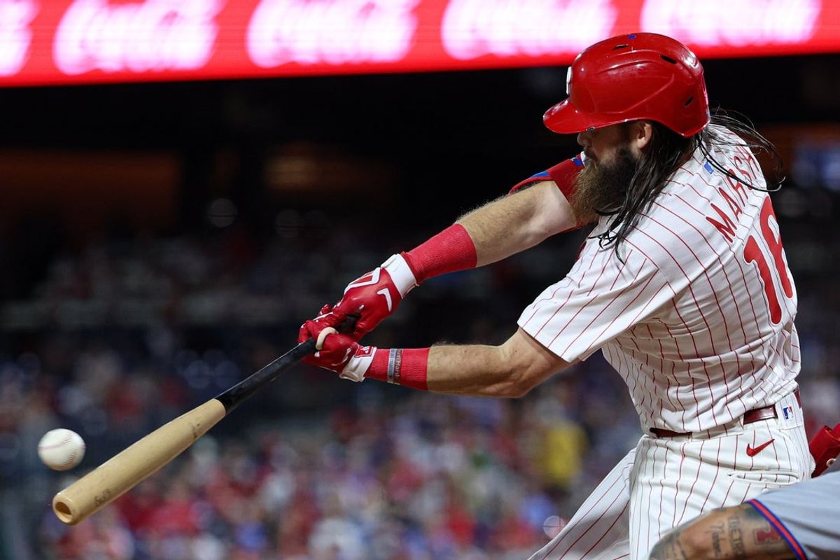 Sep 10, 2025; Philadelphia, Pennsylvania, USA; Philadelphia Phillies outfielder Brandon Marsh (16) hits a single during the third inning against the New York Mets at Citizens Bank Park. Mandatory Credit: Bill Streicher-Imagn Images