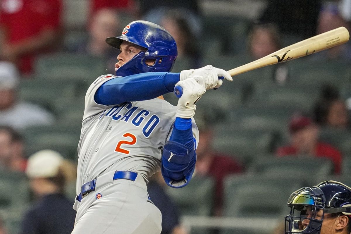 Sep 10, 2025; Cumberland, Georgia, USA; Chicago Cubs second baseman Nico Hoerner (2) singles against the Atlanta Braves during the third inning at Truist Park. Mandatory Credit: Dale Zanine-Imagn Images
