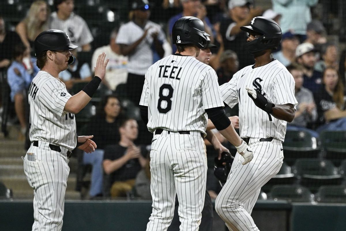 Sep 10, 2025; Chicago, Illinois, USA; Chicago White Sox shortstop Chase Meidroth (10), left, celebrates with catcher Kyle Teel (8), and outfielder Michael A. Taylor (21) after Meidroth and Taylor score against the Tampa Bay Rays during the second inning at Rate Field. Mandatory Credit: Matt Marton-Imagn Images