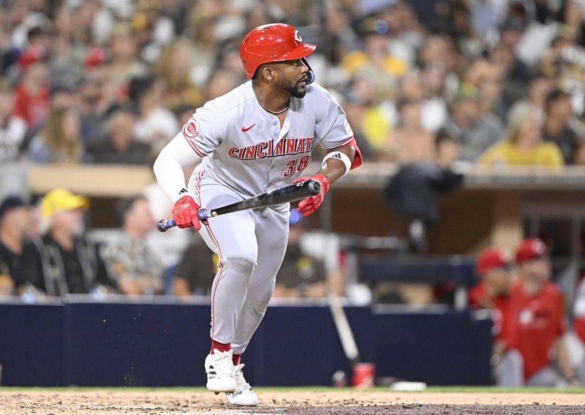 Sep 10, 2025; San Diego, California, USA; Cincinnati Reds pinch hitter Miguel Andujar (38) hits an RBI single during the eighth inning against the San Diego Padres at Petco Park. Mandatory Credit: Denis Poroy-Imagn Images