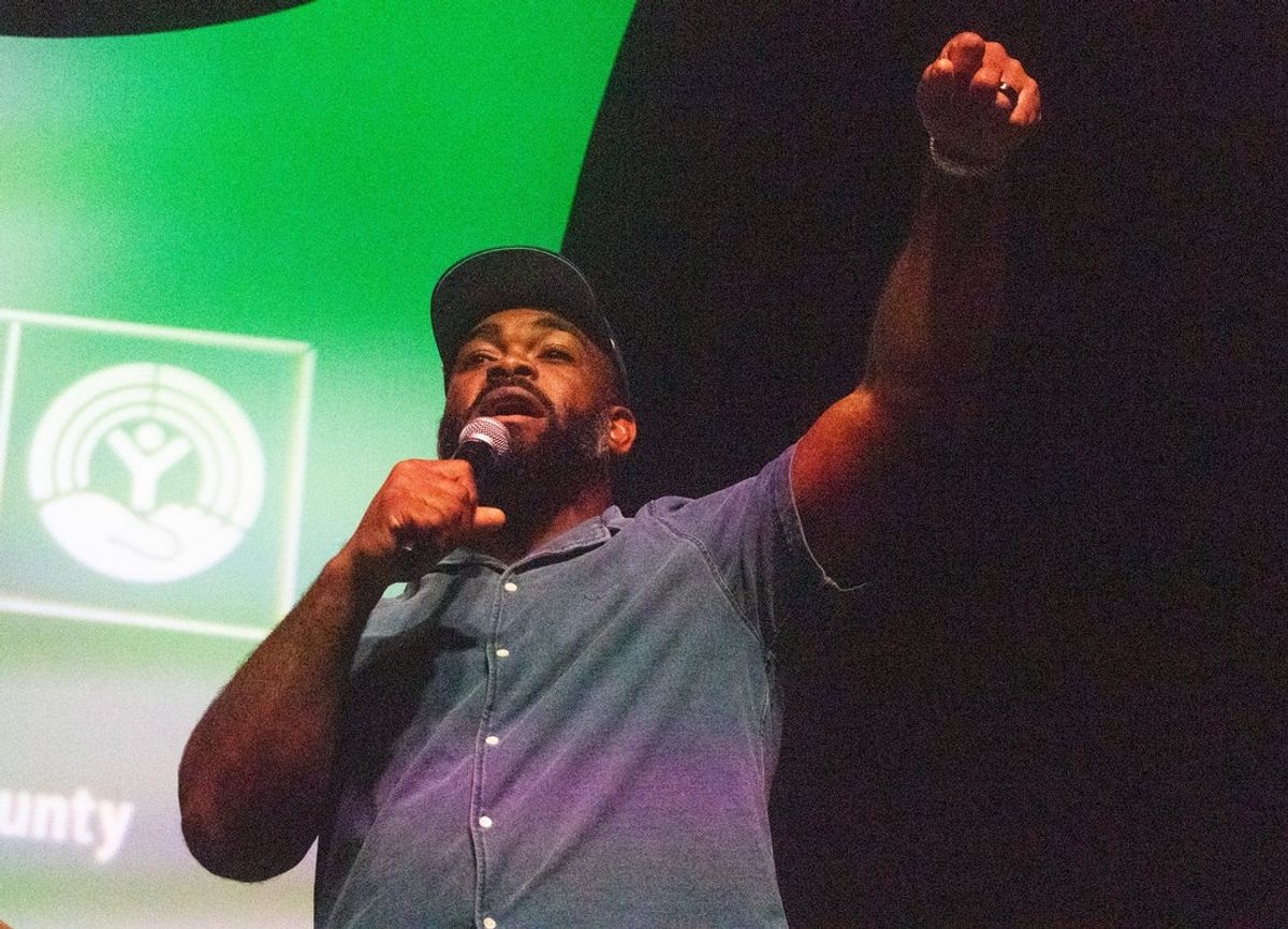 Former Philadelphia Eagles’ player and two-time Super Bowl champion Brandon Graham leads an Eagles chant with the group of attendees at the Lebanon Expo Center in Lebanon County, Pennsylvania on Wednesday, Sept. 10, 2025.