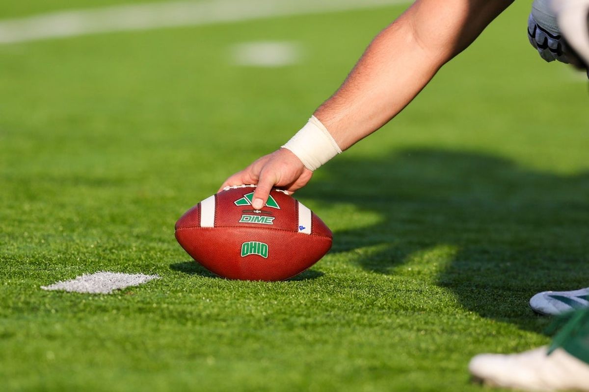 Sep 6, 2025; Athens, Ohio, USA; A football with the Ohio Bobcats logo is seen on the field during the fourth quarter of a game between the Ohio Bobcats and the West Virginia Mountaineers at Peden Stadium. Mandatory Credit: Ben Queen-Imagn Images