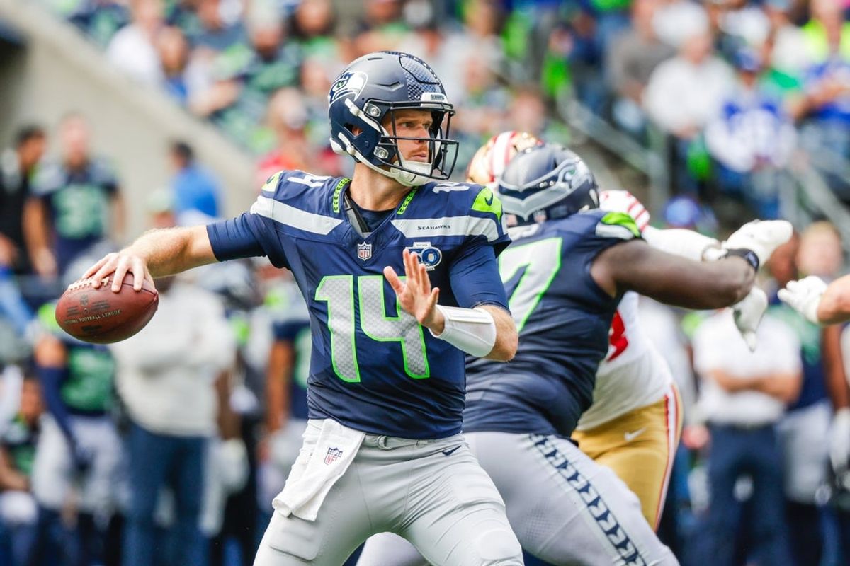 Sep 7, 2025; Seattle, Washington, USA; Seattle Seahawks quarterback Sam Darnold (14) passes against the San Francisco 49ers during the fourth quarter at Lumen Field. Mandatory Credit: Joe Nicholson-Imagn Images