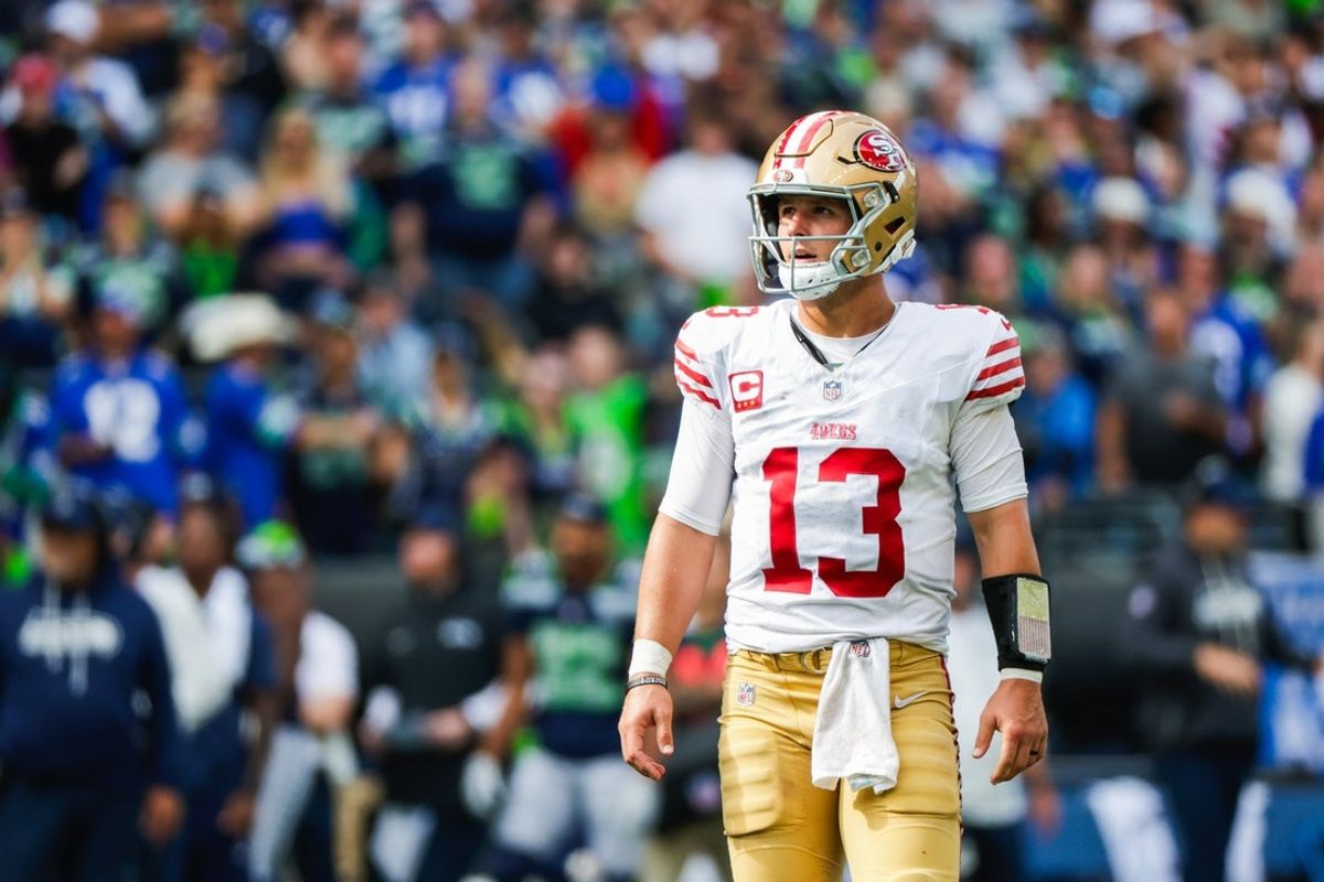Sep 7, 2025; Seattle, Washington, USA; San Francisco 49ers quarterback Brock Purdy (13) reacts following a failed third down play against the Seattle Seahawks during the fourth quarter at Lumen Field. Mandatory Credit: Joe Nicholson-Imagn Images