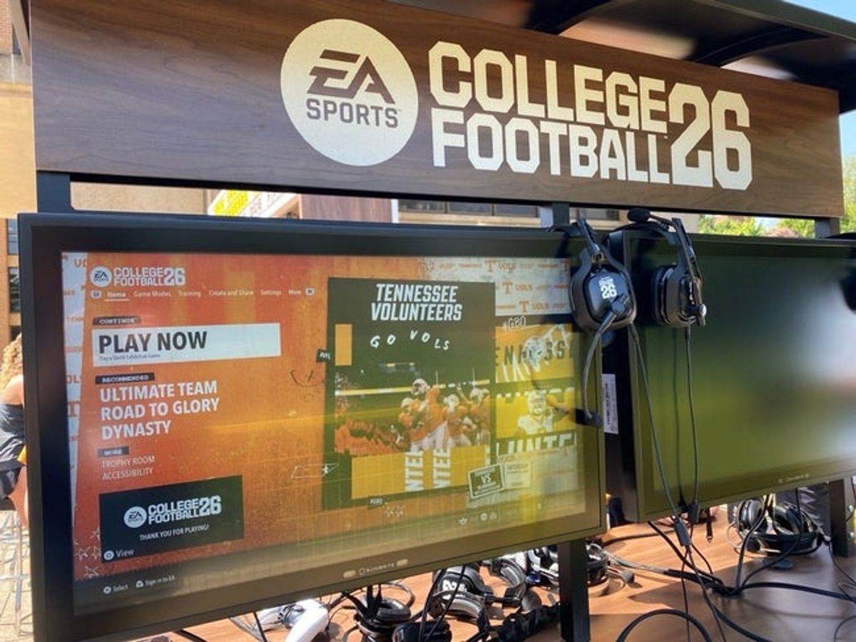 One of the stations where students and fans can play EA Sports College Football 26. The game is ready for players to pick up the controllers and start playing.