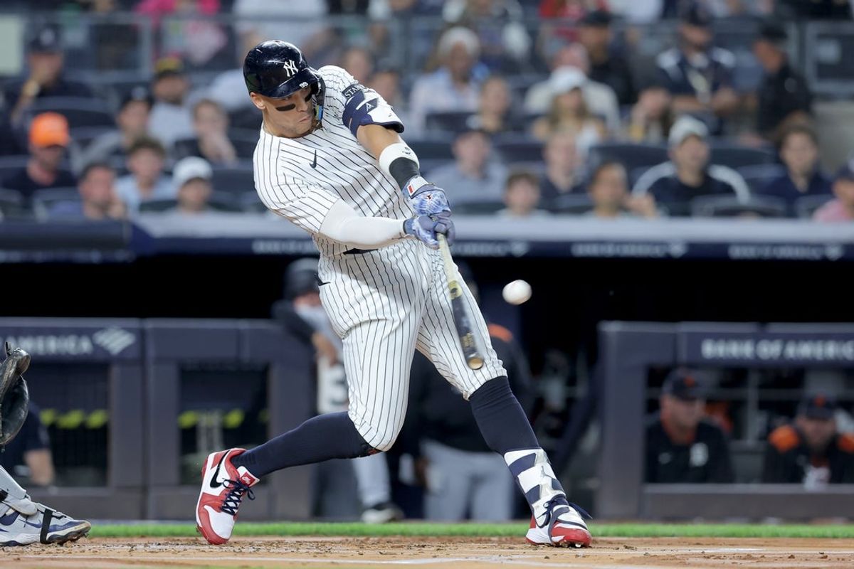 Sep 11, 2025; Bronx, New York, USA; New York Yankees right fielder Aaron Judge (99) hits a solo home run against the Detroit Tigers during the first inning at Yankee Stadium. Mandatory Credit: Brad Penner-Imagn Images
