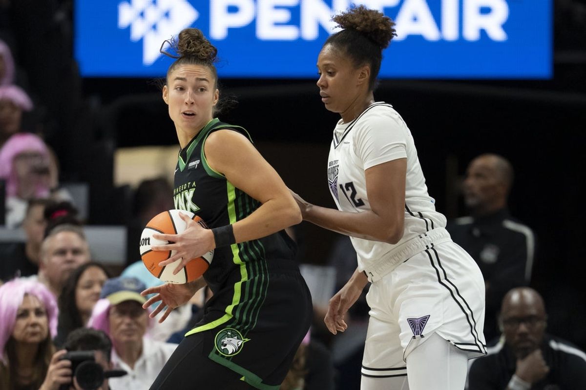 Sep 11, 2025; Minneapolis, Minnesota, USA; Minnesota Lynx forward Jessica Shepard (15) dribbles against Golden State Valkyries center Iliana Rupert (12) in the first half at Target Center. Mandatory Credit: Jesse Johnson-Imagn Images