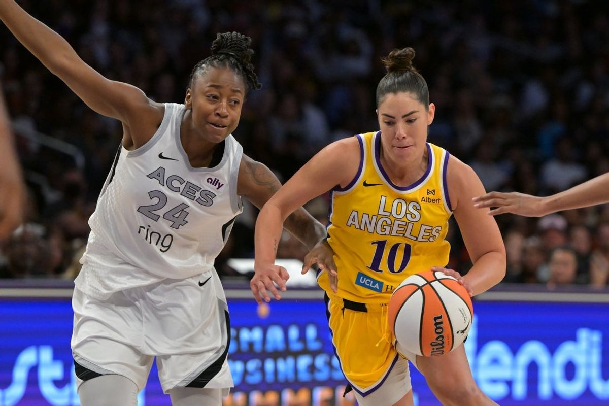 Sep 11, 2025; Los Angeles, California, USA; Los Angeles Sparks guard Kelsey Plum (10) is defended by Las Vegas Aces guard Jewell Loyd (24) as she drives to the basket during the second half at Crypto.com Arena. Mandatory Credit: Jayne Kamin-Oncea-Imagn Images