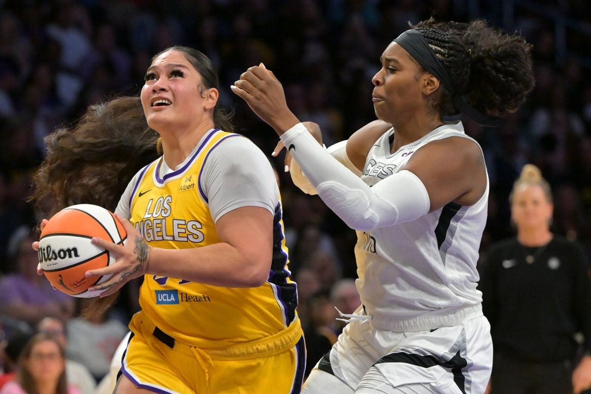 Sep 11, 2025; Los Angeles, California, USA; Las Vegas Aces forward Cheyenne Parker-Tyus (32) guards Los Angeles Sparks forward Alissa Pili (24) during the second half at Crypto.com Arena. Mandatory Credit: Jayne Kamin-Oncea-Imagn Images