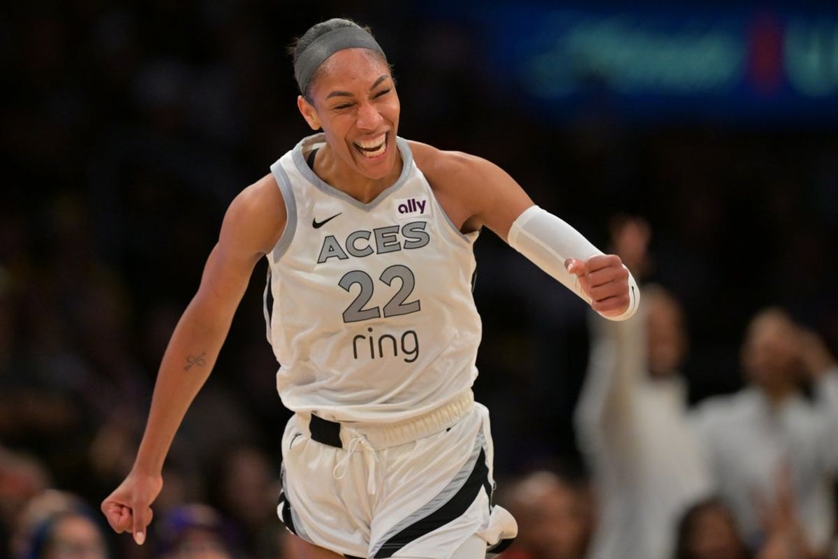 Sep 11, 2025; Los Angeles, California, USA; Las Vegas Aces center A'ja Wilson (22) celebrates after a 3 pointer during the second half against the Los Angeles Sparks at Crypto.com Arena. Mandatory Credit: Jayne Kamin-Oncea-Imagn Images
