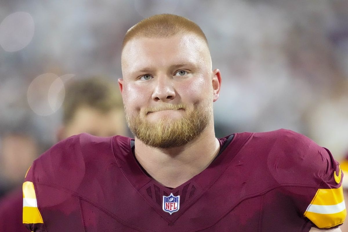 Sep 11, 2025; Green Bay, Wisconsin, USA;  Washington Commanders center Tyler Biadasz (63) prior to the game against the Green Bay Packers at Lambeau Field. Mandatory Credit: Jeff Hanisch-Imagn Images