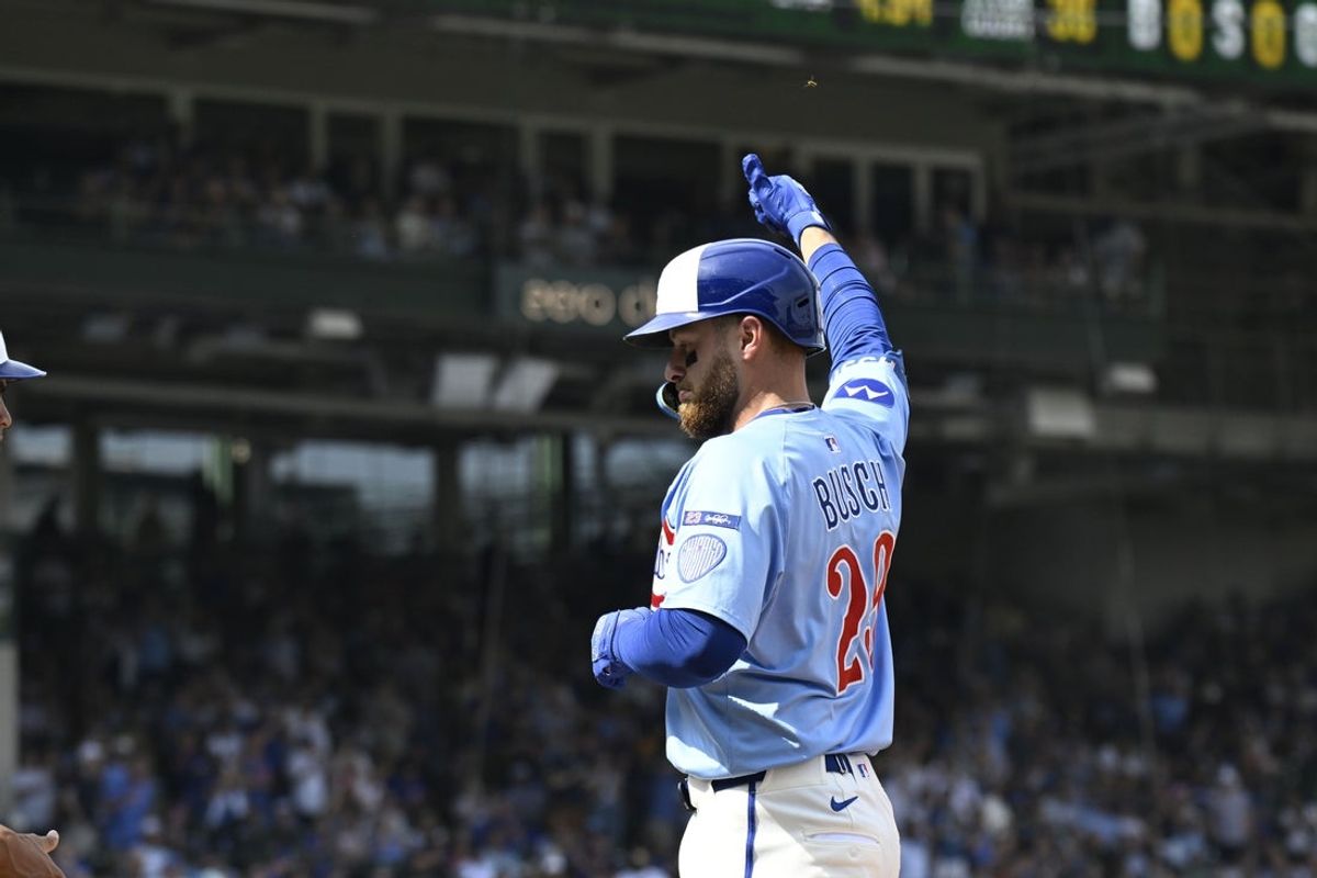 Sep 12, 2025; Chicago, Illinois, USA;  Chicago Cubs first baseman Michael Busch (29) points after he hits an RBI single against the Tampa Bay Rays during the second inning at Wrigley Field. Mandatory Credit: Matt Marton-Imagn Images