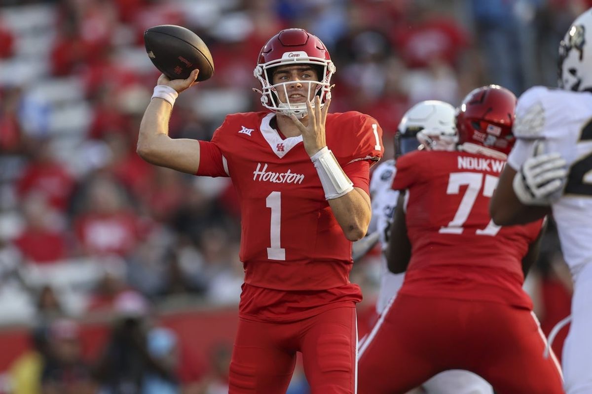 Sep 12, 2025; Houston, Texas, USA; Houston Cougars quarterback Conner Weigman (1) attempts a pass during the first quarter against the Colorado Buffaloes at TDECU Stadium. Mandatory Credit: Troy Taormina-Imagn Images