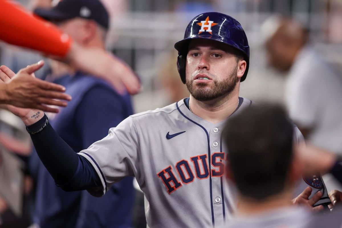 Sep 12, 2025; Atlanta, Georgia, USA; Houston Astros catcher Victor Caratini (17) celebrates with teammates after scoring a run against the Atlanta Braves in the fifth inning at Truist Park. Mandatory Credit: Brett Davis-Imagn Images