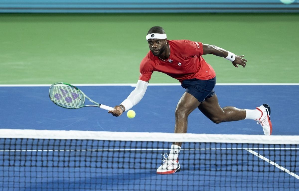 Sep 12, 2025; Delray Beach, FL, USA;  Frances Tiafoe of the United States returns a shot against Jiri Lehecka of Czechia in the first rubber of the Davis Cup tie between the USA and Czechia at Delray Beach Tennis Center. Mandatory Credit: Susan Mullane-Imagn Images