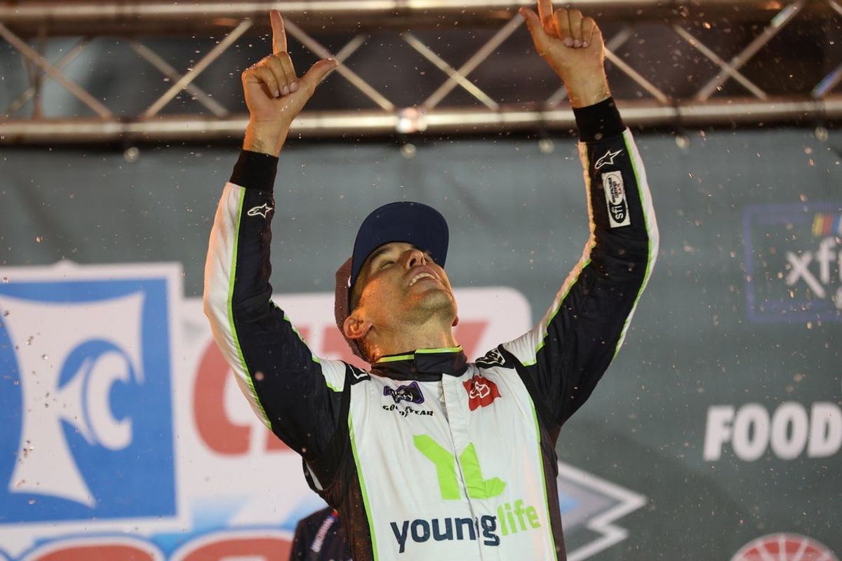 Sep 12, 2025; Bristol, Tennessee, USA;  NASCAR Xfinity Series driver Aric Almirola (19) wins the Food City 300 at Bristol Motor Speedway. Mandatory Credit: Randy Sartin-Imagn Images
