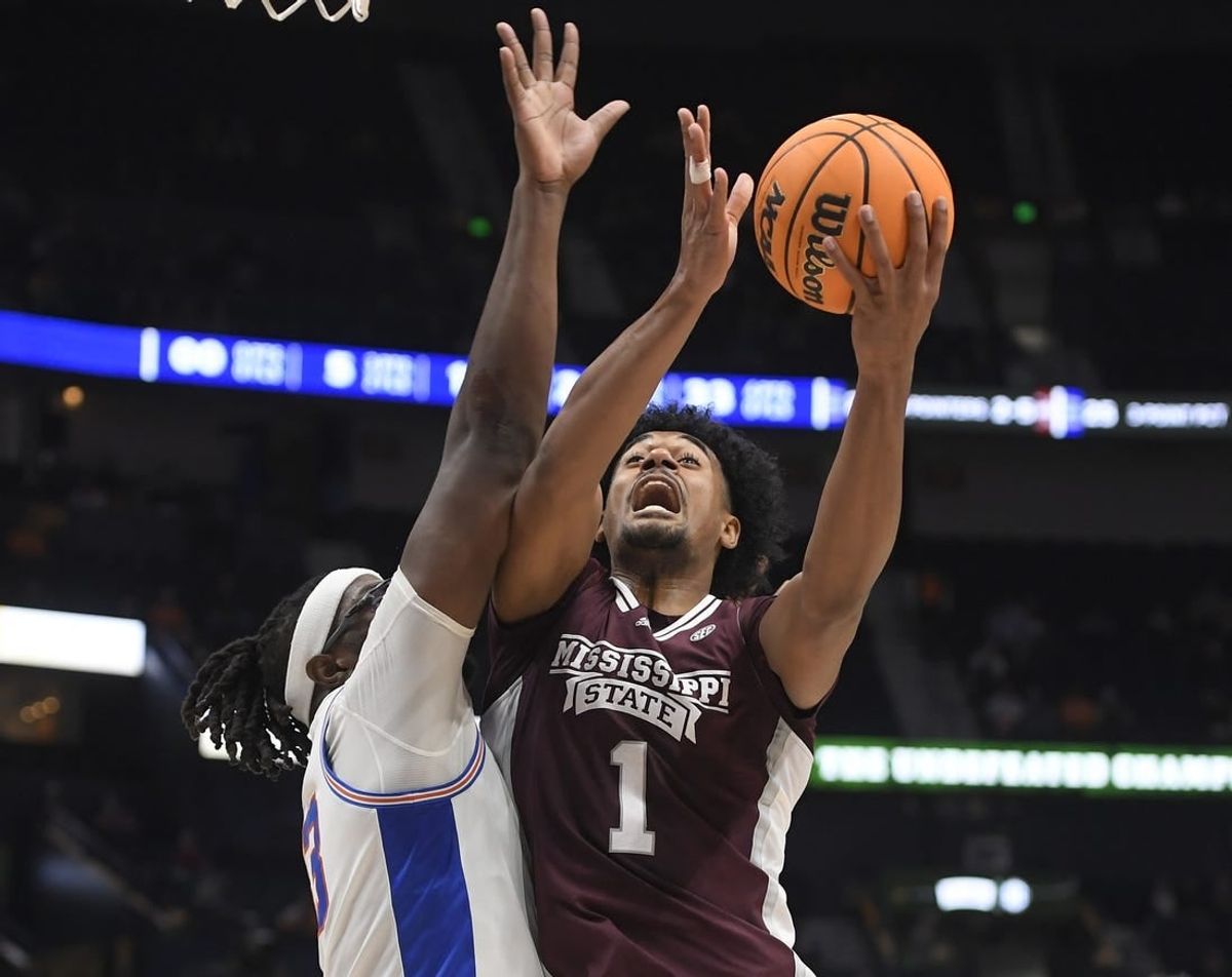 Mar 9, 2023; Nashville, TN, USA;  Mississippi State Bulldogs forward Tolu Smith (1) shoots over Florida Gators center Jason Jitoboh (33) during the first half at Bridgestone Arena.