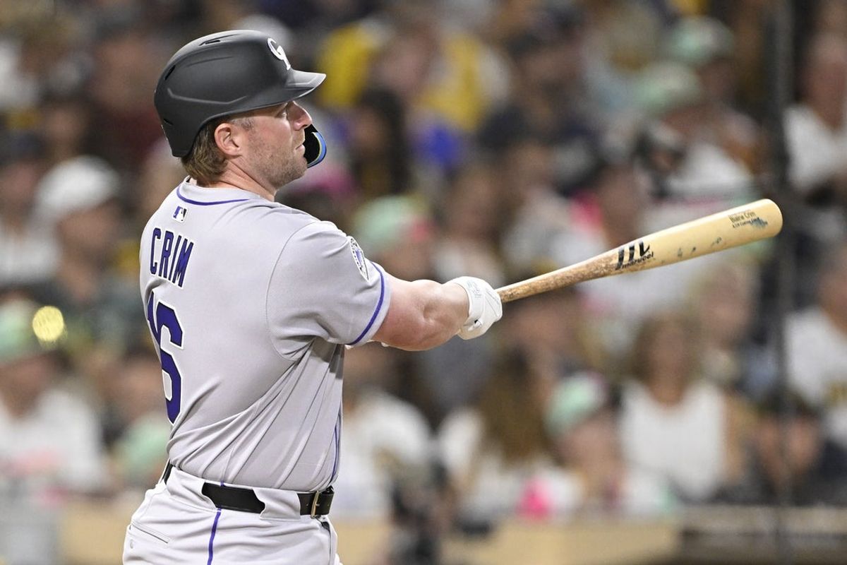 Sep 12, 2025; San Diego, California, USA; Colorado Rockies first baseman Blaine Crim (16) hits a three-run home run during the fourth inning against the San Diego Padres at Petco Park. Mandatory Credit: Denis Poroy-Imagn Images