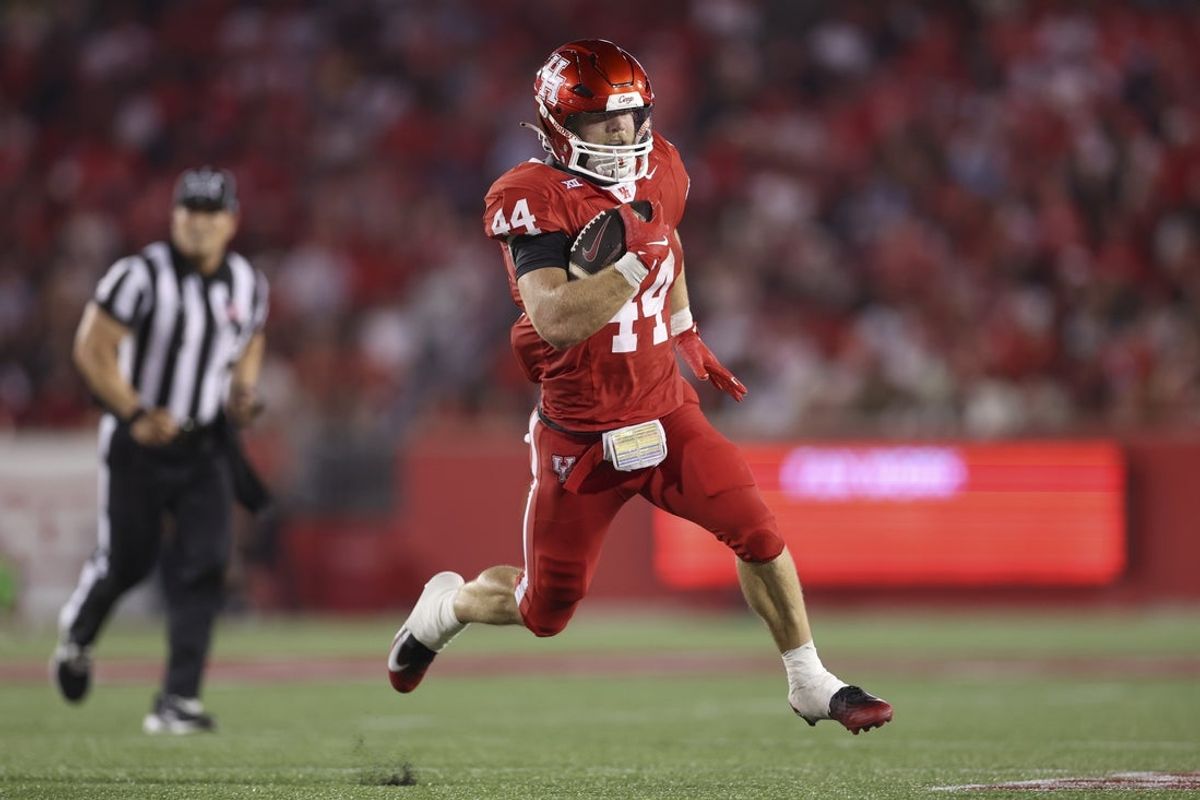 Sep 12, 2025; Houston, Texas, USA; Houston Cougars running back Dean Connors (44) runs with the ball during the third quarter against the Colorado Buffaloes at TDECU Stadium. Mandatory Credit: Troy Taormina-Imagn Images