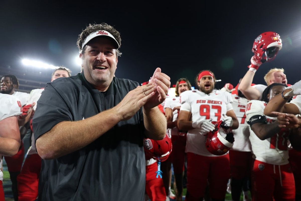 Sep 12, 2025; Pasadena, California, USA;  New Mexico Lobos head coach Jason Eck celebrates with his players after defeating the UCLA Bruins 35-10 at the Rose Bowl. Mandatory Credit: Kiyoshi Mio-Imagn Images