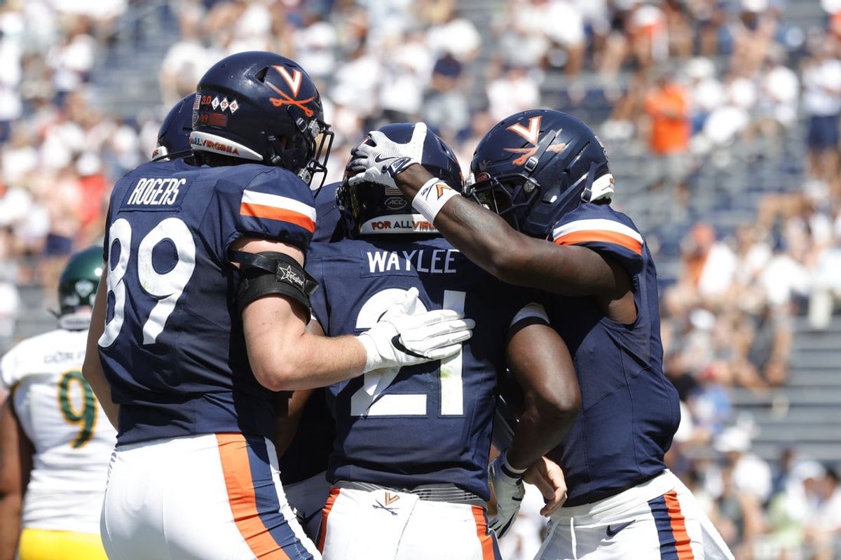Sep 13, 2025; Charlottesville, Virginia, USA; Virginia Cavaliers running back Harrison Waylee (21) celebrates with teammates after scoring a touchdown against the William & Mary Tribe during the second quarter at Scott Stadium. Mandatory Credit: Amber Searls-Imagn Images