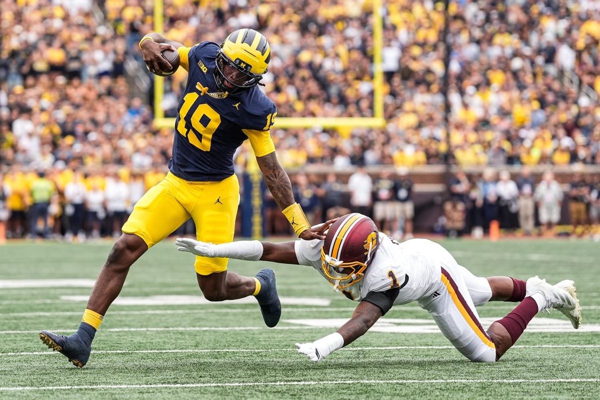 Michigan quarterback Bryce Underwood (19) runs against Central Michigan Central Michigan linebacker Dakota Cochran (1) during the first half at Michigan Stadium in Ann Arbor on Saturday, Sept. 13, 2025.
