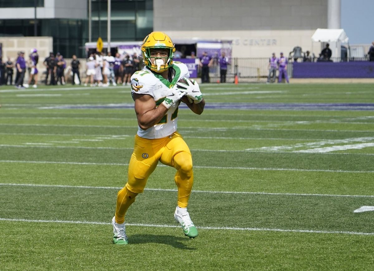 Sep 13, 2025; Evanston, Illinois, USA; Oregon Ducks running back Jayden Limar (27) runs for a touchdown against the Northwestern Wildcats during the first half at Northwestern Medicine Field at Martin Stadium. Mandatory Credit: David Banks-Imagn Images