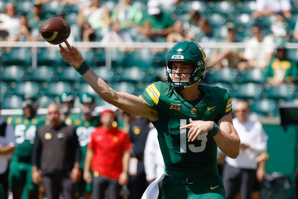 Sep 13, 2025; Waco, Texas, USA; Baylor Bears quarterback Sawyer Robertson (13) throws the balll upfield against the Samford Bulldogs during the first half at McLane Stadium. Mandatory Credit: Chris Jones-Imagn Images
