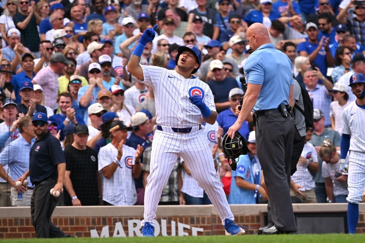 Sep 13, 2025; Chicago, Illinois, USA; Chicago Cubs designated hitter Moises Ballesteros (25) crosses home plate and celebrates his first MLB home run against the Tampa Bay Rays during the second inning at Wrigley Field. Mandatory Credit: Patrick Gorski-Imagn Images