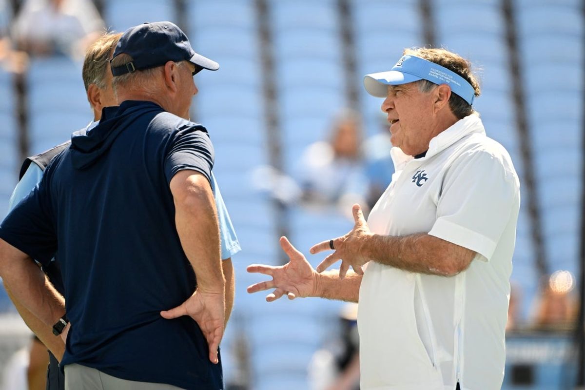 Sep 13, 2025; Chapel Hill, North Carolina, USA; North Carolina Tar Heels head coach Bill Belichick with Richmond Spiders head coach Russ Huesman before the game at Kenan Stadium. Mandatory Credit: Bob Donnan-Imagn Images
