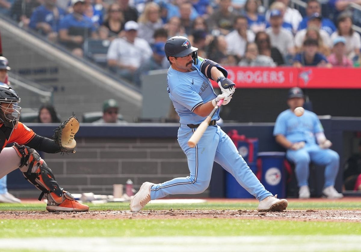 Sep 13, 2025; Toronto, Ontario, CAN; Toronto Blue Jays left fielder Davis Schneider (36) hits a single against the Baltimore Orioles during the fifth inning at Rogers Centre. Mandatory Credit: Nick Turchiaro-Imagn Images