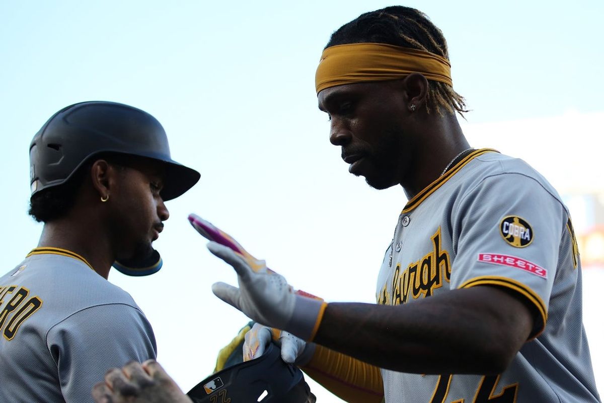 Sep 13, 2025; Washington, District of Columbia, USA; Pittsburgh Pirates outfielder Andrew McCutchen (22) celebrates after scoring a run during the eighth inning against the Washington Nationals at Nationals Park. Mandatory Credit: Daniel Kucin Jr.-Imagn Images