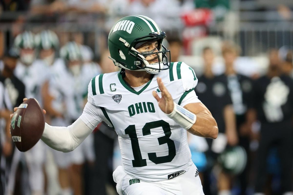 Sep 13, 2025; Columbus, Ohio, USA; Ohio Bobcats quarterback Parker Navarro (13) drops back to pass during the first quarter against the Ohio State Buckeyes at Ohio Stadium. Mandatory Credit: Joseph Maiorana-Imagn Images