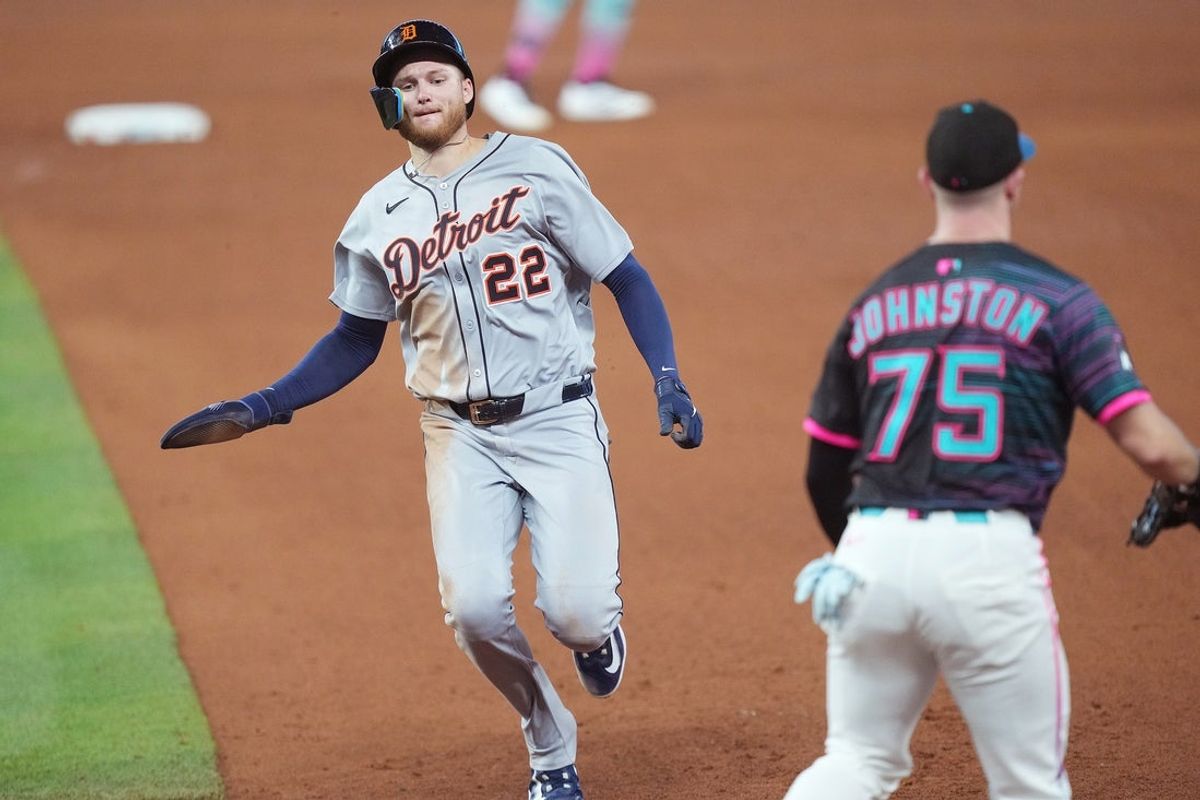 Sep 13, 2025; Miami, Florida, USA;  Detroit Tigers center fielder Parker Meadows (22) runs back to first base to avoid being tagged out in the fifth inning at loanDepot Park. Mandatory Credit: Jim Rassol-Imagn Images