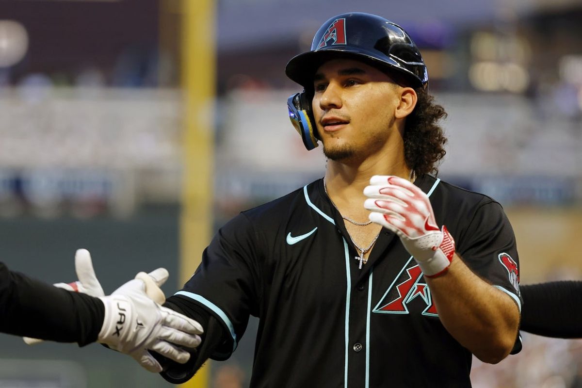 Sep 13, 2025; Minneapolis, Minnesota, USA; Arizona Diamondbacks center fielder Alek Thomas (5) celebrates his two-run home run against the Minnesota Twins in the fourth inning  at Target Field. Mandatory Credit: Bruce Kluckhohn-Imagn Images