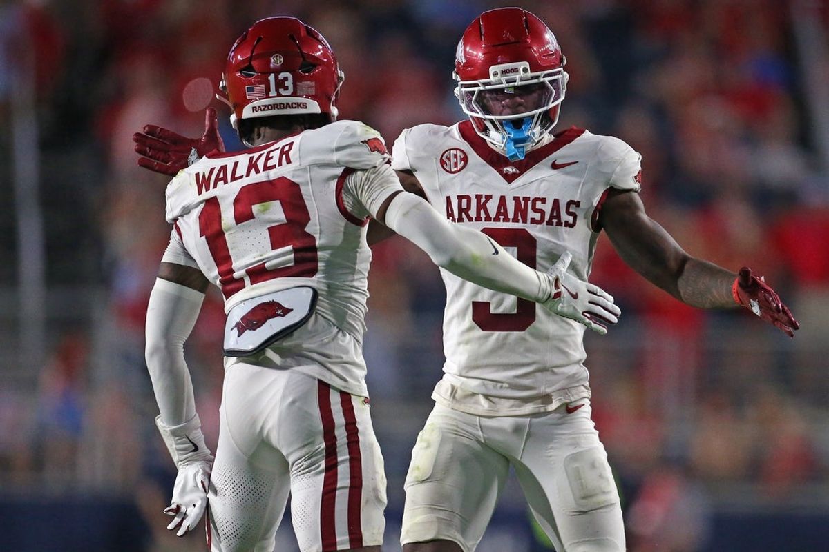 Sep 13, 2025; Oxford, Mississippi, USA; Arkansas Razorback defensive back Larry Worth III (3) and defensive back Kani Walker (13) react during the second quarter against the Mississippi Rebels at Vaught-Hemingway Stadium. Mandatory Credit: Petre Thomas-Imagn Images