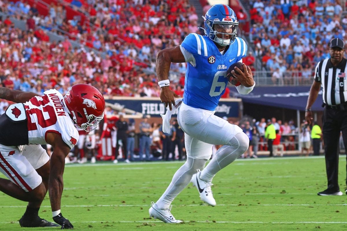 Sep 13, 2025; Oxford, Mississippi, USA; Mississippi Rebels quarterback Trinidad Chambliss (6) runs the ball for a touchdown during the second quarter against the Arkansas Razorback at Vaught-Hemingway Stadium. Mandatory Credit: Petre Thomas-Imagn Images