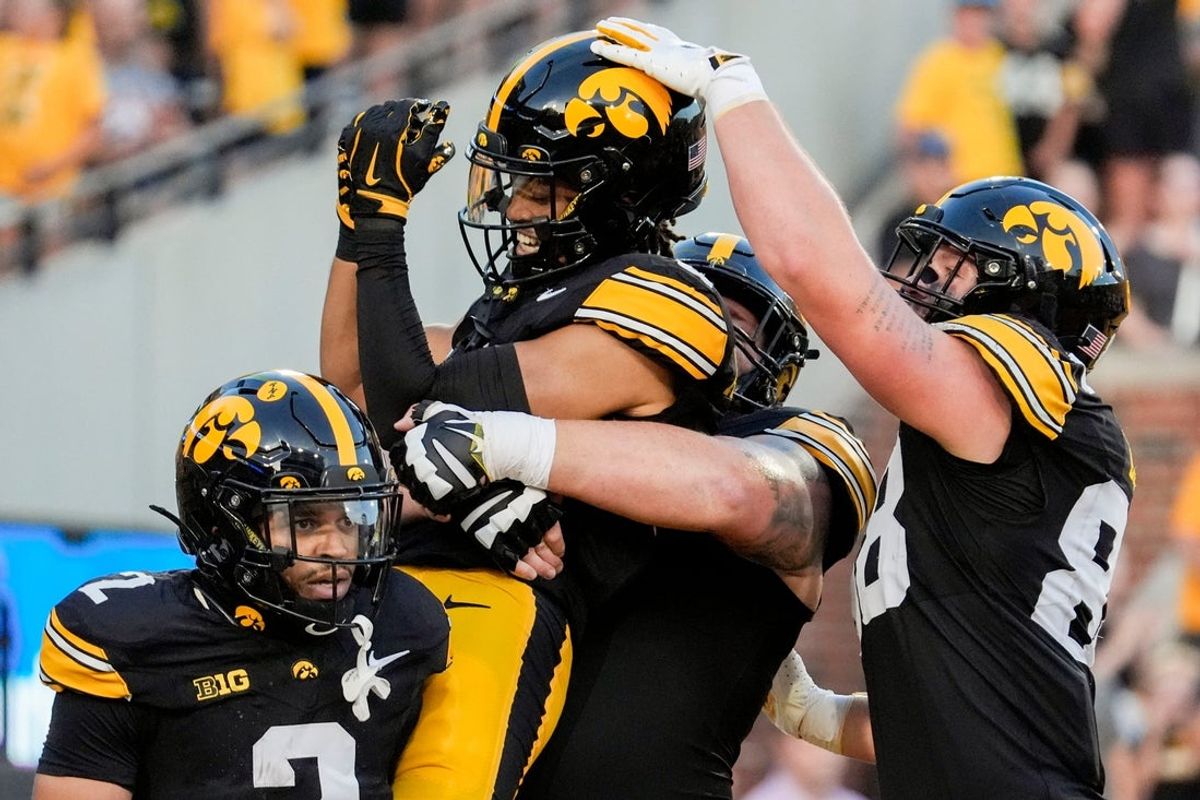 Iowa Hawkeyes wide receiver Seth Anderson (6) is lifted into the air as teammates celebrate his touchdown with him during a football game against the Massachusetts Minutemen Sept. 13, 2025 at Kinnick Stadium in Iowa City, Iowa.