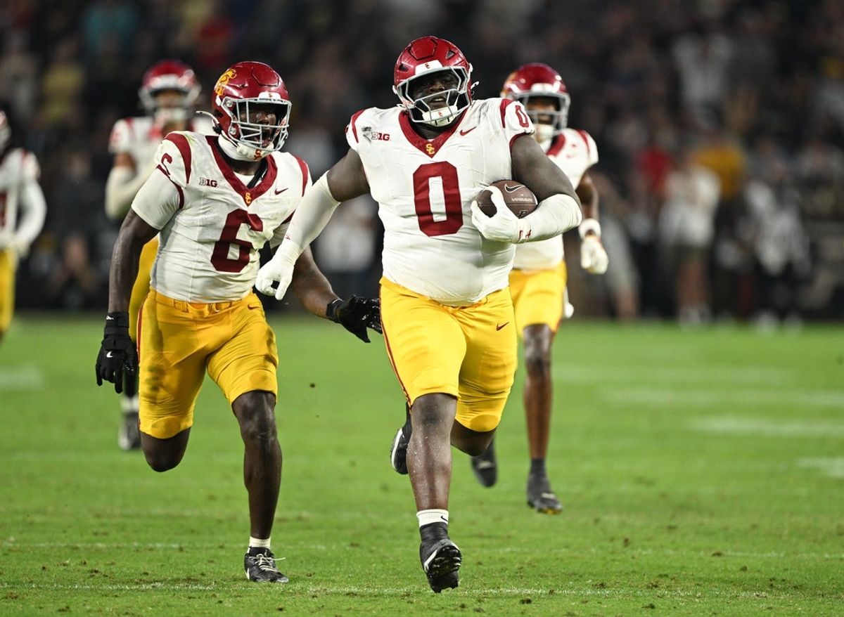 Sep 13, 2025; West Lafayette, Indiana, USA;  USC Trojans defensive tackle Jamaal Jarrett (0) runs the ball in for a touchdown after intercepting it during the second half against the Purdue Boilermakers at Ross-Ade Stadium. Mandatory Credit: Marc Lebryk-Imagn Images